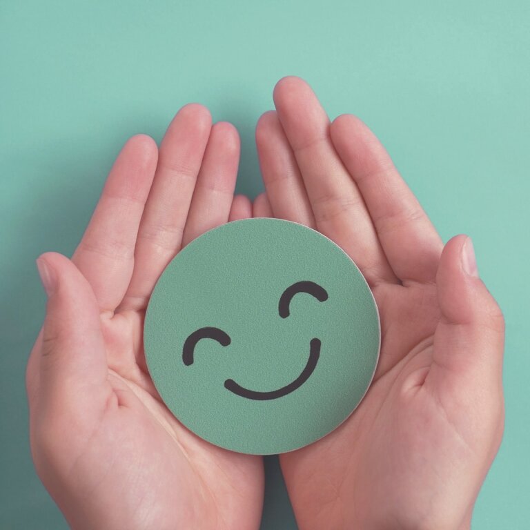 hands holding smiling heart